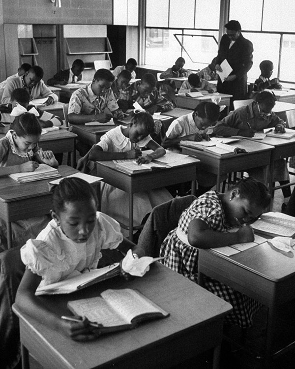 African American students study in class.