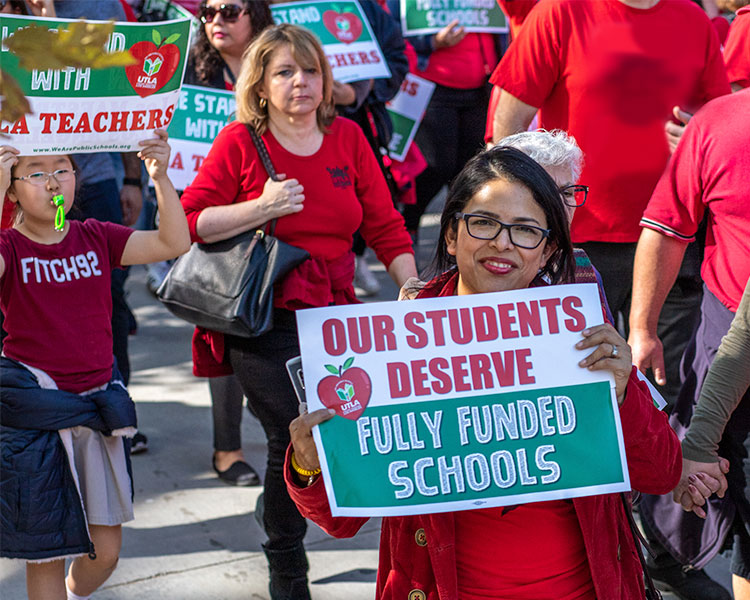 A group of teachers protesting for fully funded schools