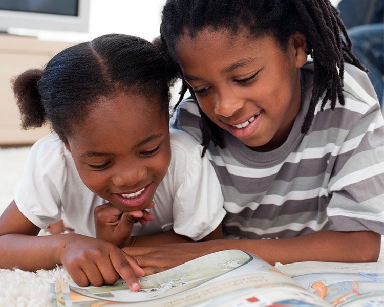 Siblings reading together