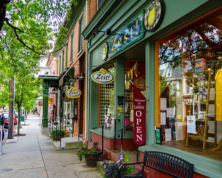 Photo of a town street with a variety of stores