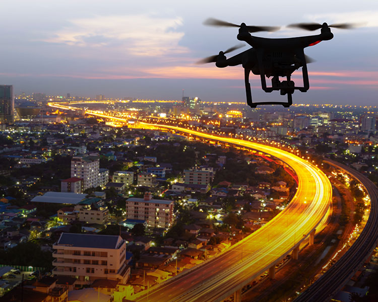 Image of a drone over a city at night