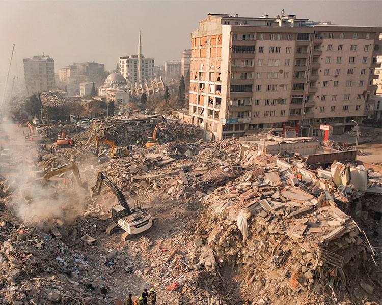 Aerial view of leftover debris from destroyed buildings in a city