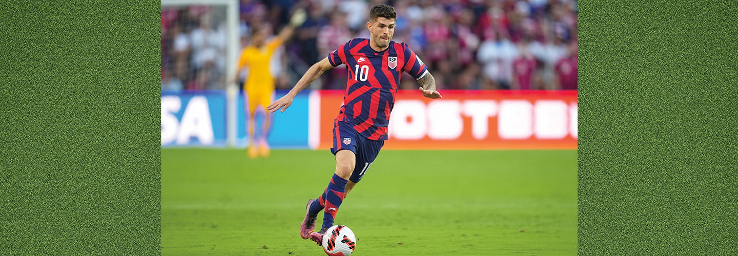 Photo of a professional soccer player dribbling the ball