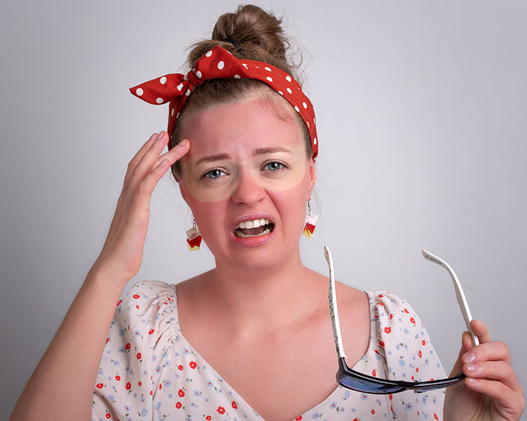 Photo of a person with a sunburn and sunglasses tan