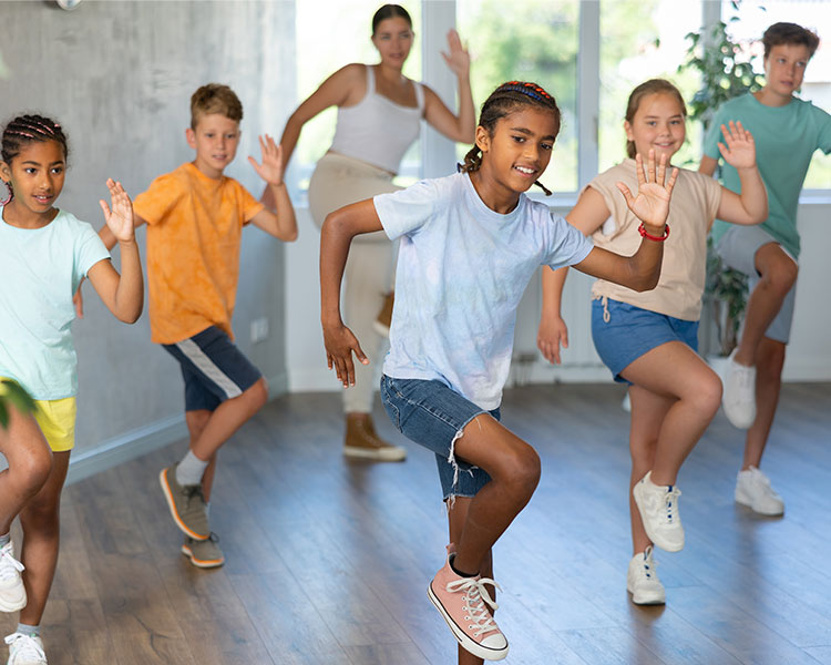 Photo of a group of people performing organized dance