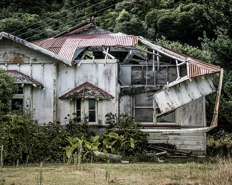 Image of an abandoned building, falling apart