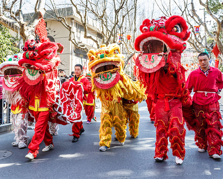 Photo of a Chinese Parade with people dressed as dragons