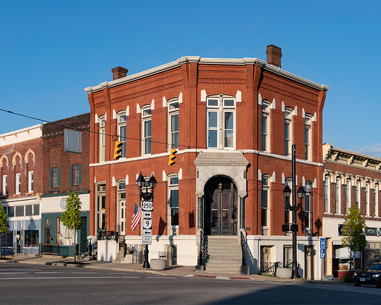 A brick corner building on a street